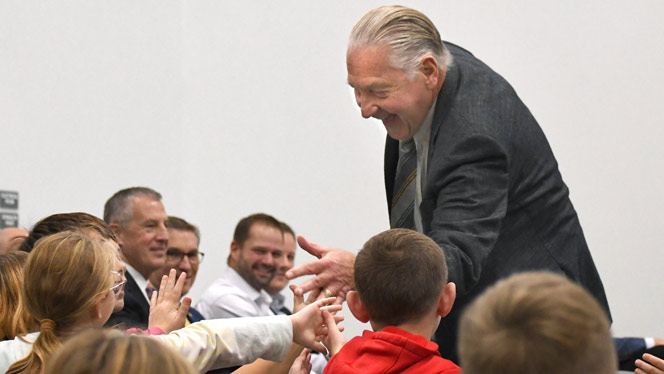 K-8 School in Belmont: NHA Founder J.C. Huizenga celebrates with Chandler Woods students.